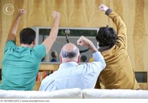 Men_Cheering_and_Watching_Soccer_Game_on_TV_42-18538803.jpg